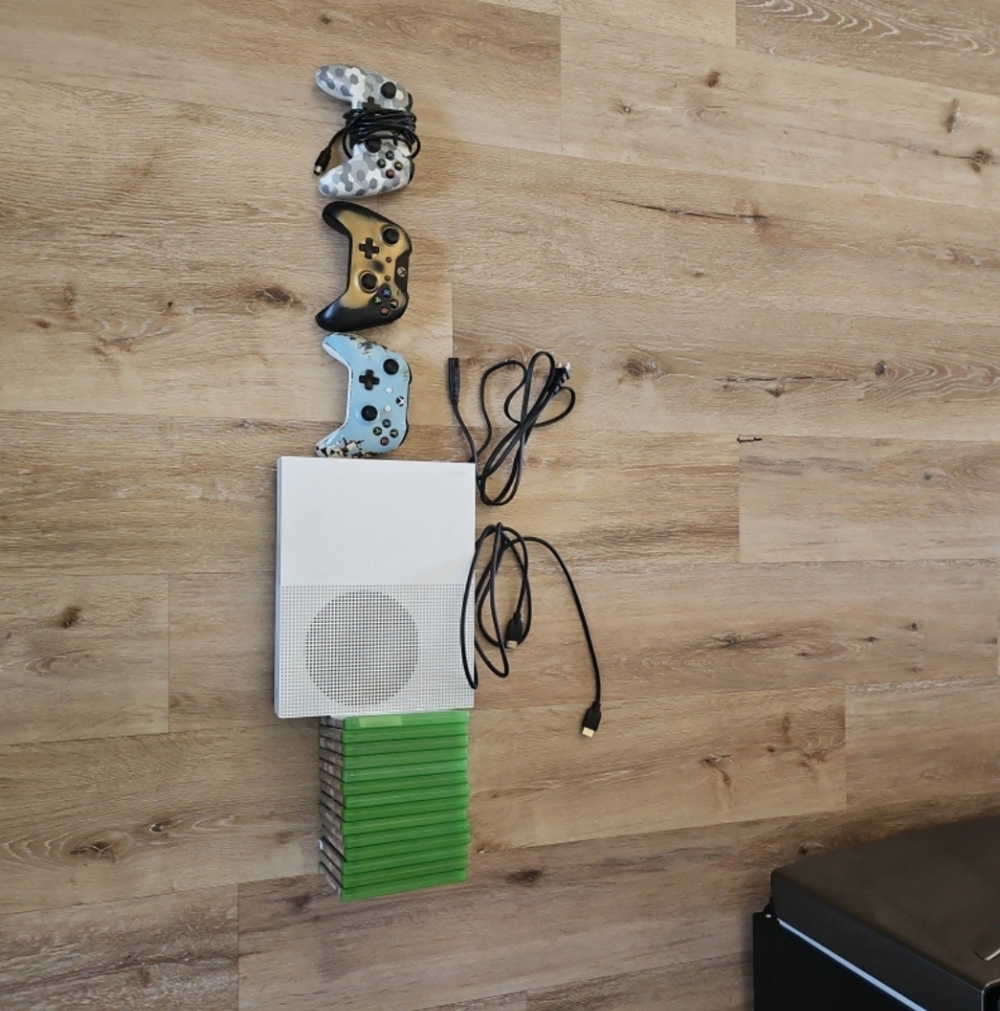 White Gaming Console with Controllers and Games